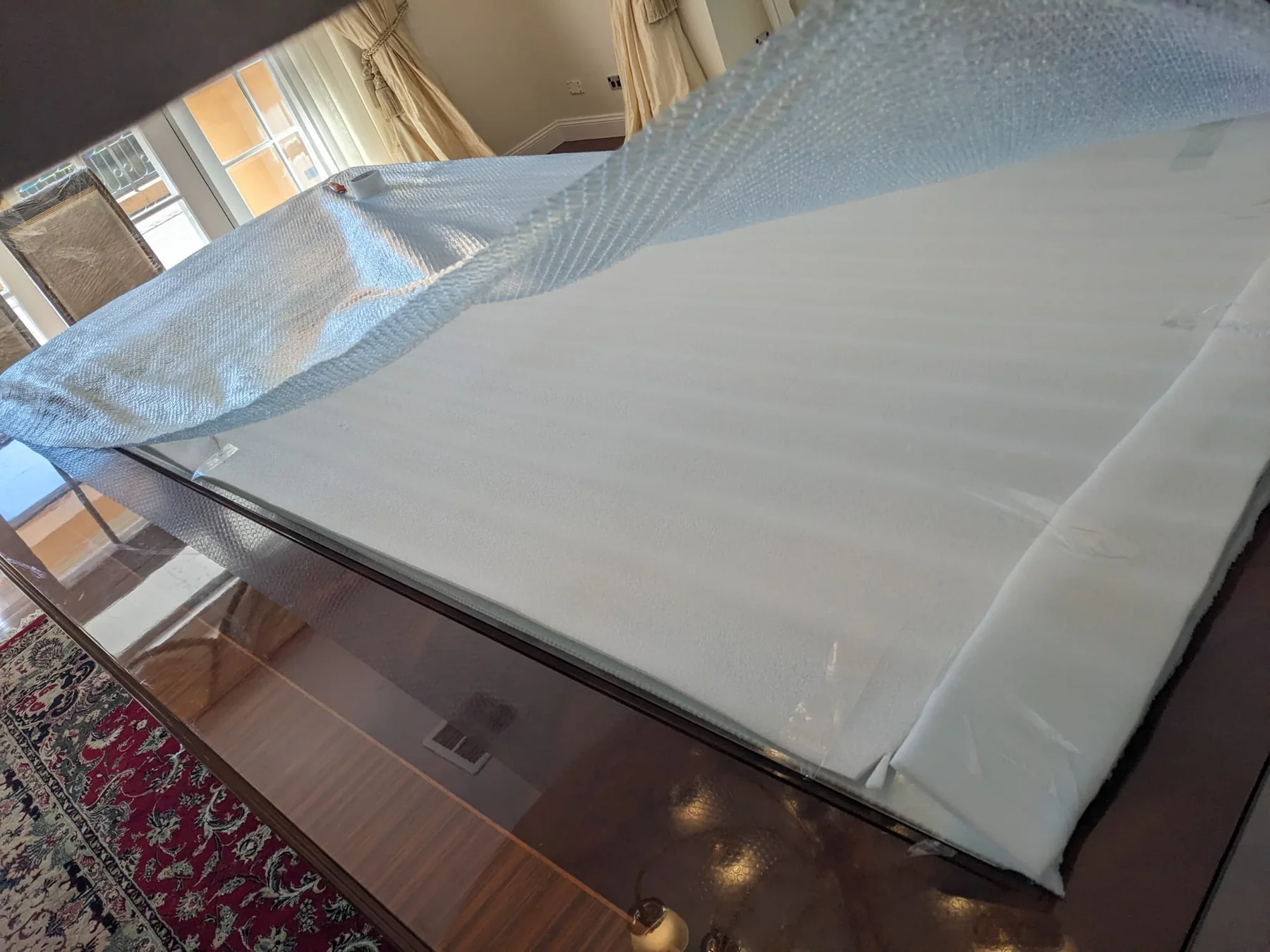 Large furniture wrapped in protective material